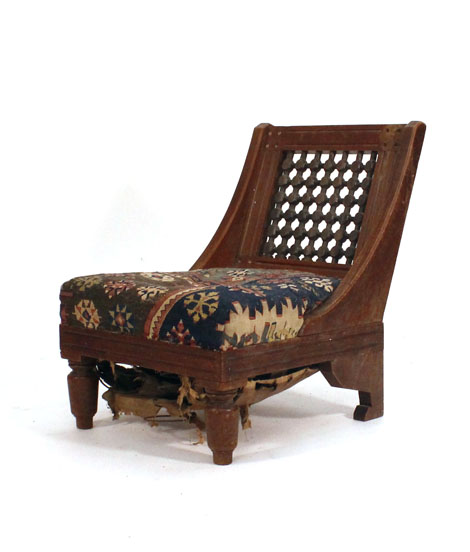 An early 20th century Moorish-style fireside chair in the manner of Liberty & Co. 

   CONDITION