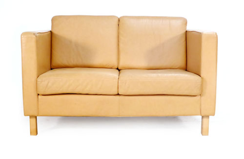 A two seater tan leather sofa on straight beech legs by Horup   CONDITION REPORT:  Good, some