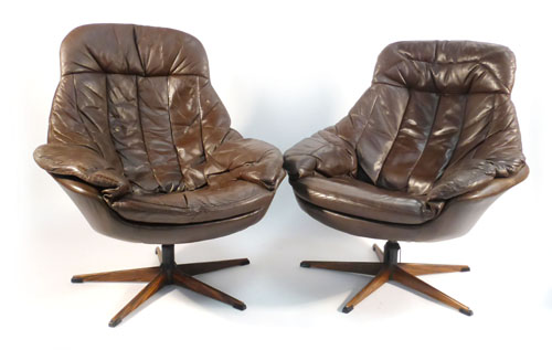 H W Klein, for Bramin, a pair of brown and leather tub chairs on simulated rosewood five star bases