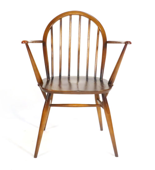 A stained elm Ercol spindle back carver   CONDITION REPORT:  Generally good