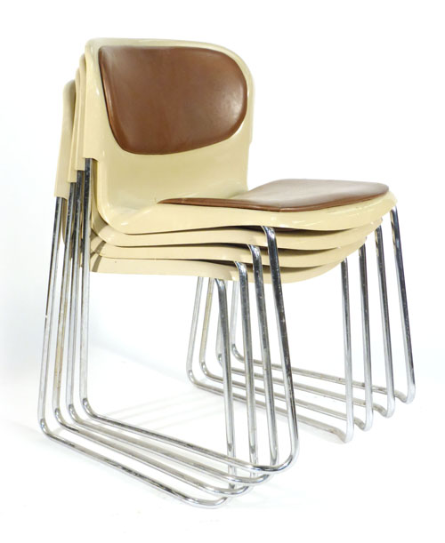 A set of four West German plastic stacking chairs on metal tubular frames in brown   CONDITION
