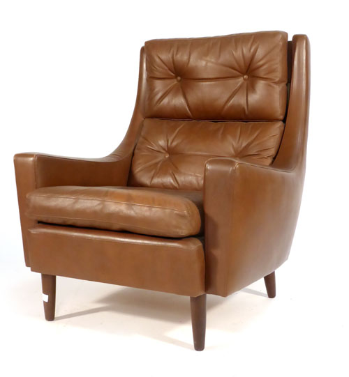 A brown leather armchair on mahogany legs   CONDITION REPORT:  Some normal wear but generally