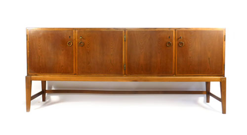 A Danish elm cross banded sideboard with an arrangement of four doors revealing birch interior, l.