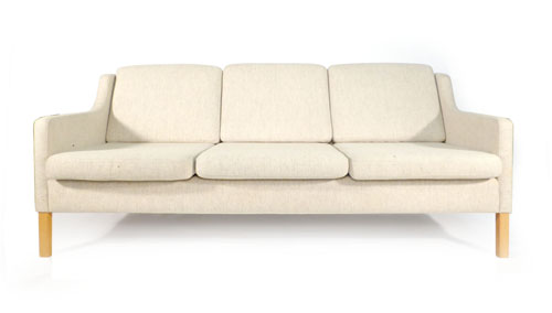 A Stouby three seater sofa with white upholstery on beech straight legs   CONDITION REPORT:  Some