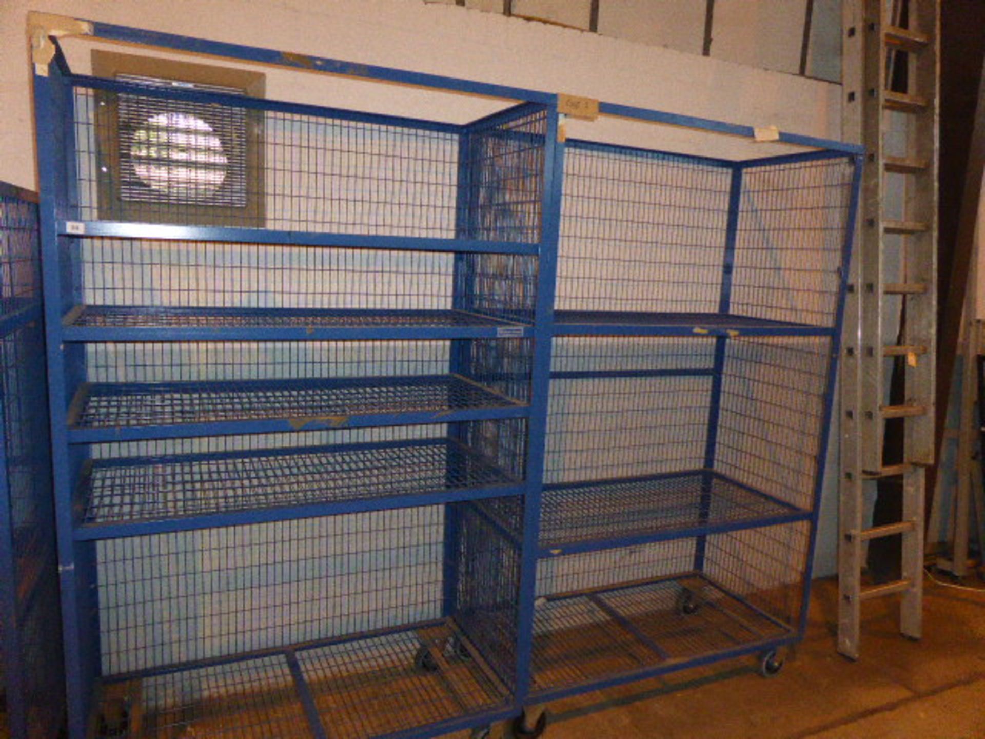 2 Welconstruct blue mesh mobile storage racks approx 2m high