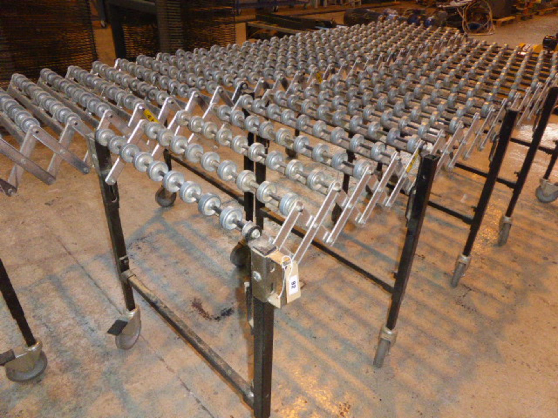 2 sections of expandable roller conveyor on castors