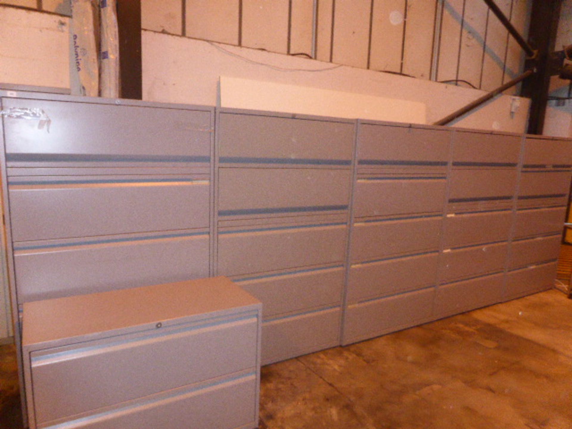 5 grey steel lateral filing cabinets each with 3 drawers and a lift top shelf and matching 2