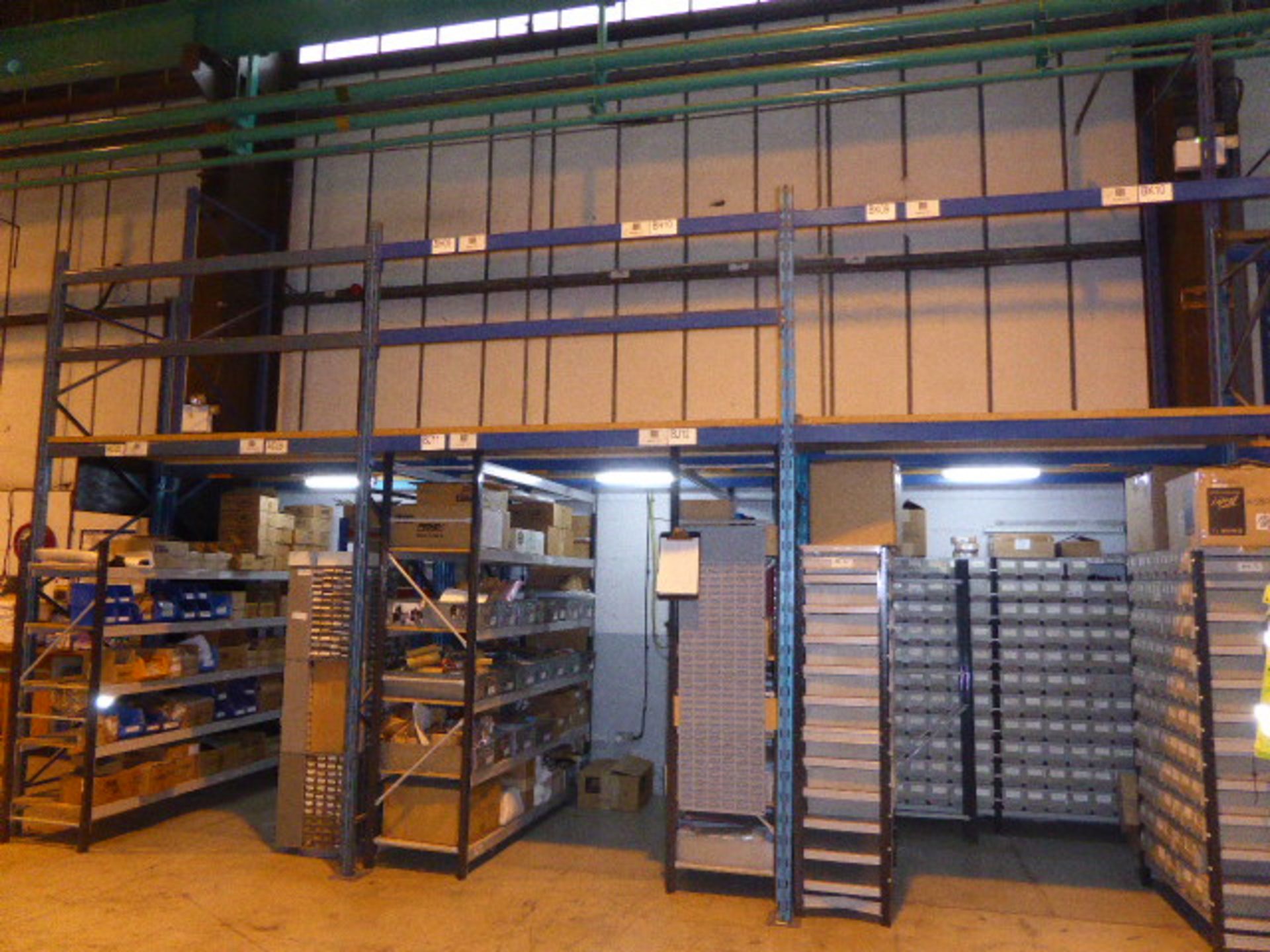 Small mezzanine floor constructed on KS racking frames, beams and chipboard flooring with single