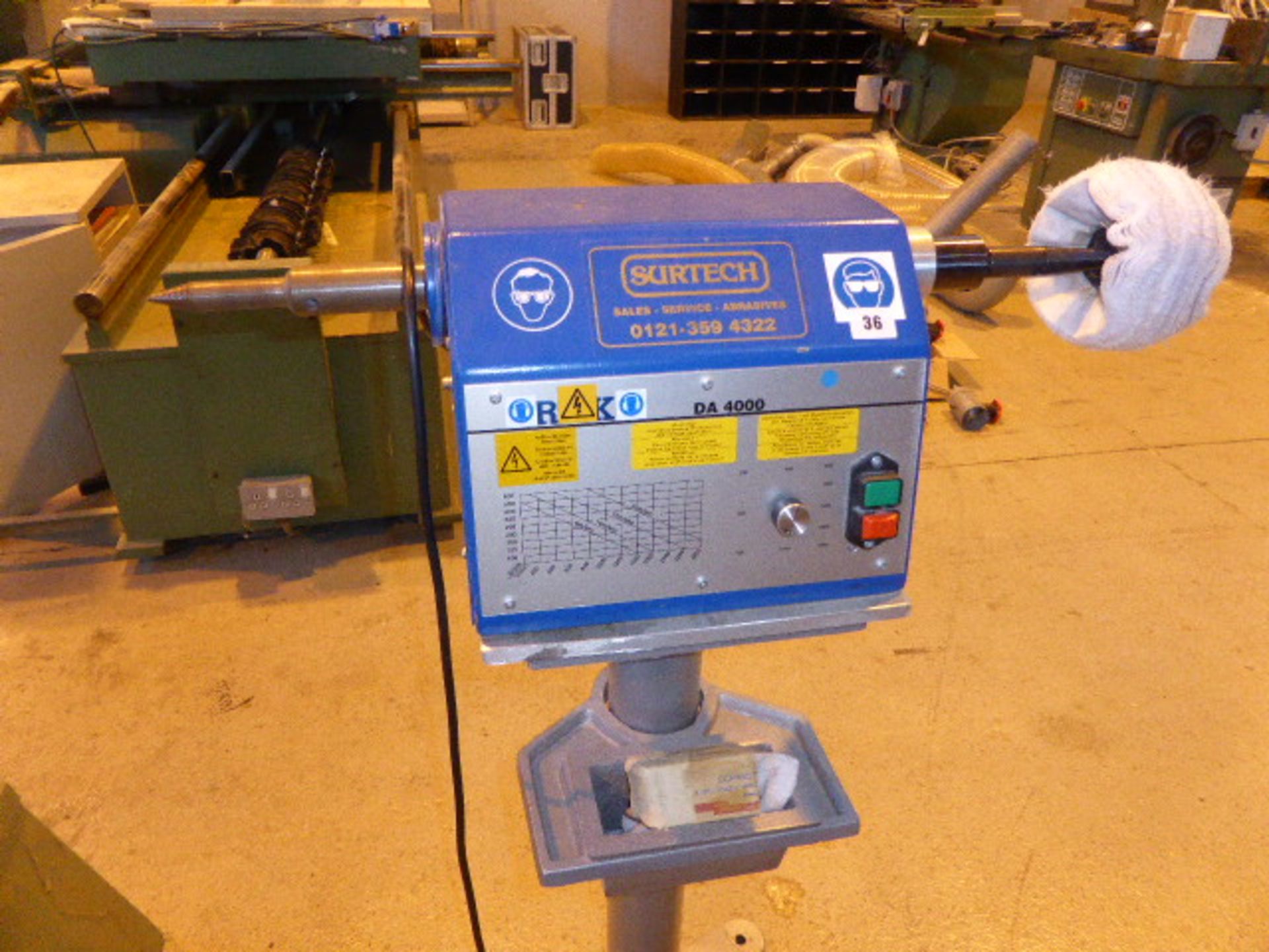 Surtech single phase electric polishing spindle on pedestal mount with a range of polishing heads