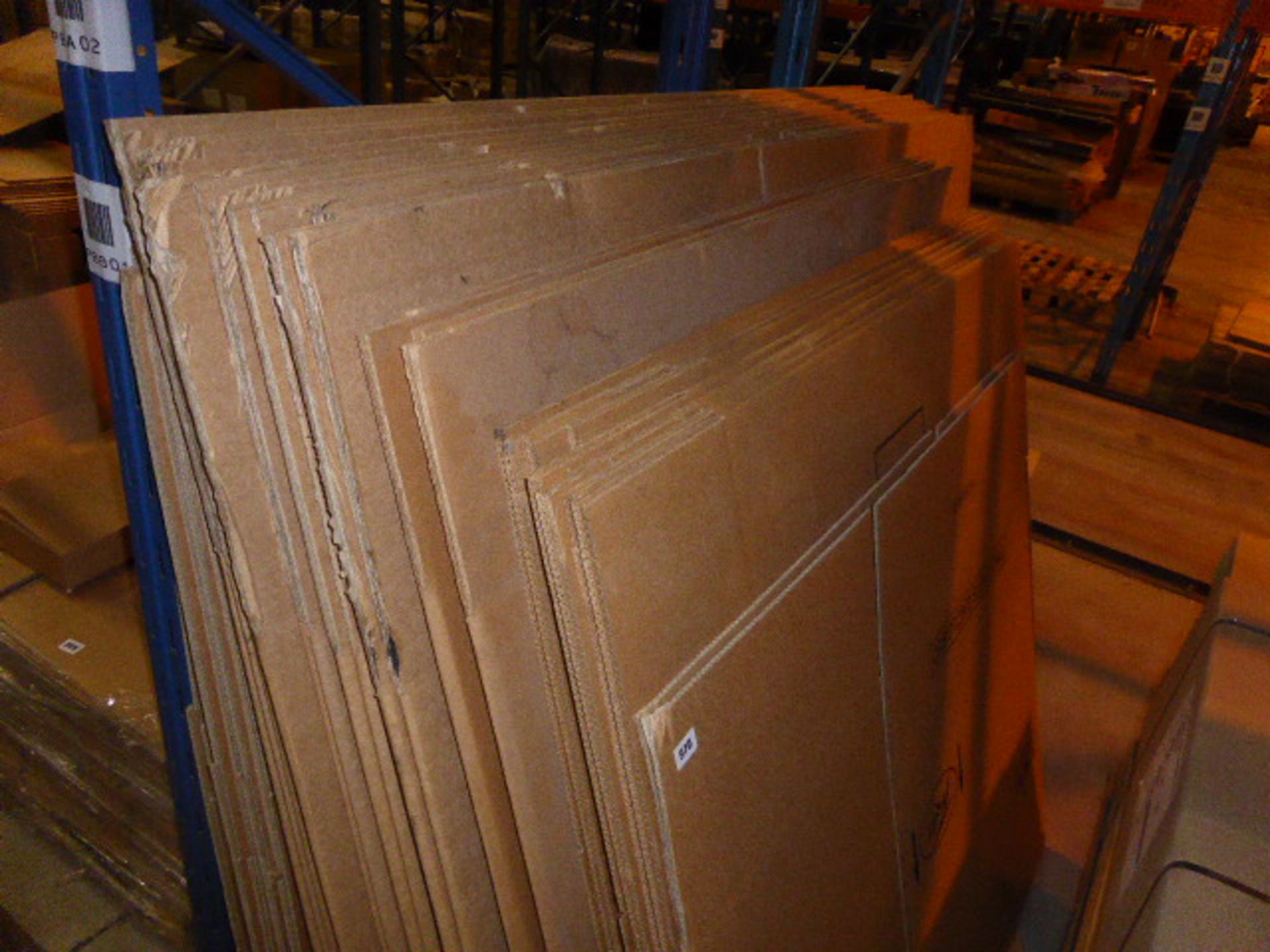 Stack of assorted sized large cardboard boxes