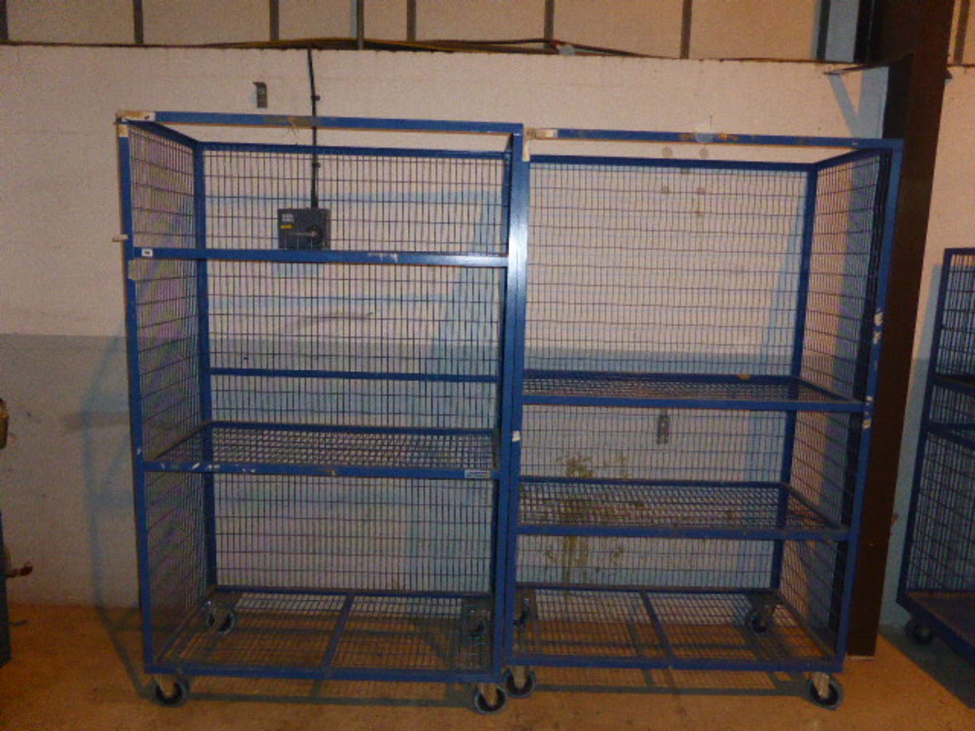 2 Welconstruct blue mesh mobile storage racks approx 2m high