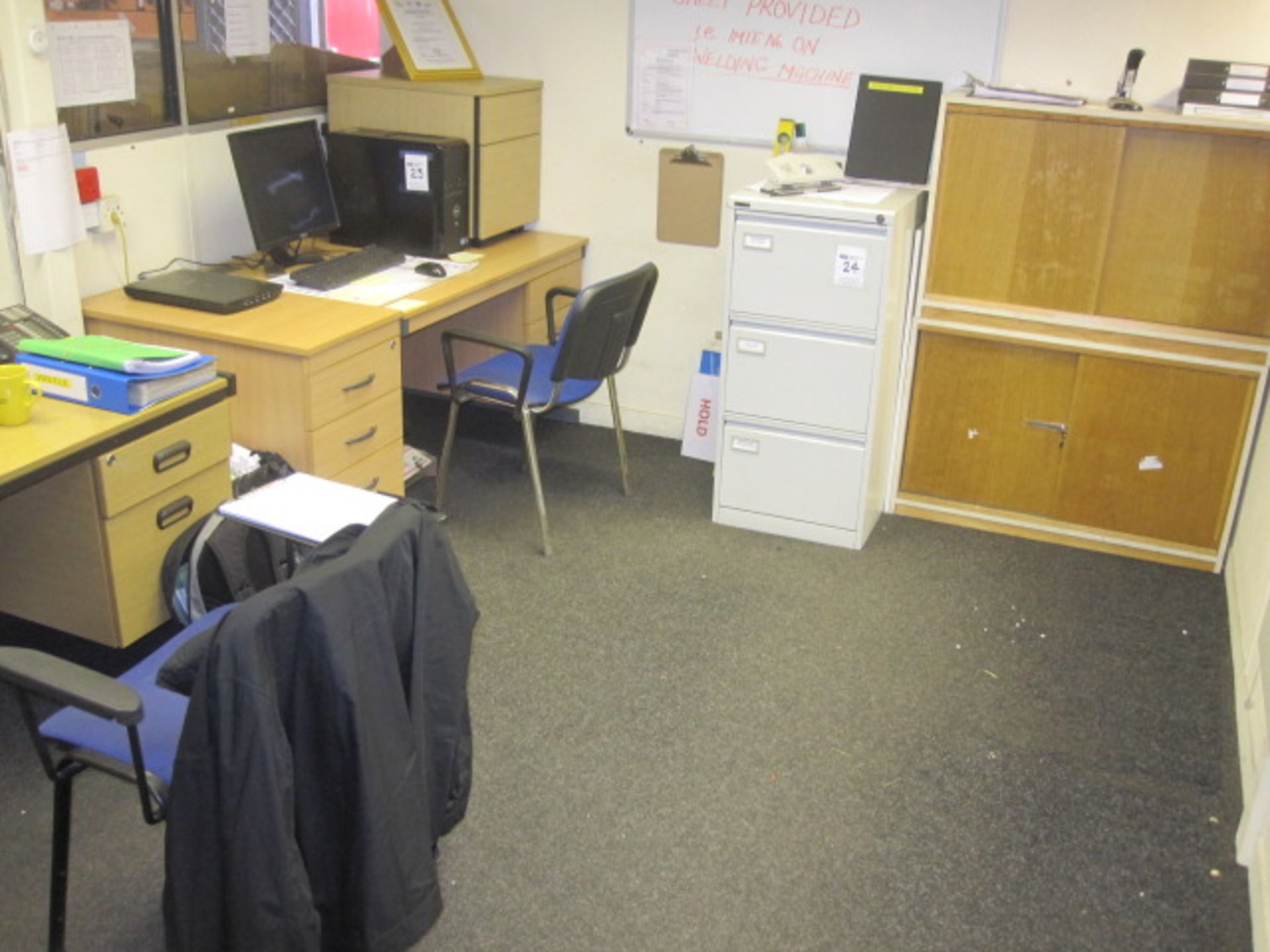 Remaining furniture in office including 2 desks, 2 filing cabinets 2 chairs and a bookcase