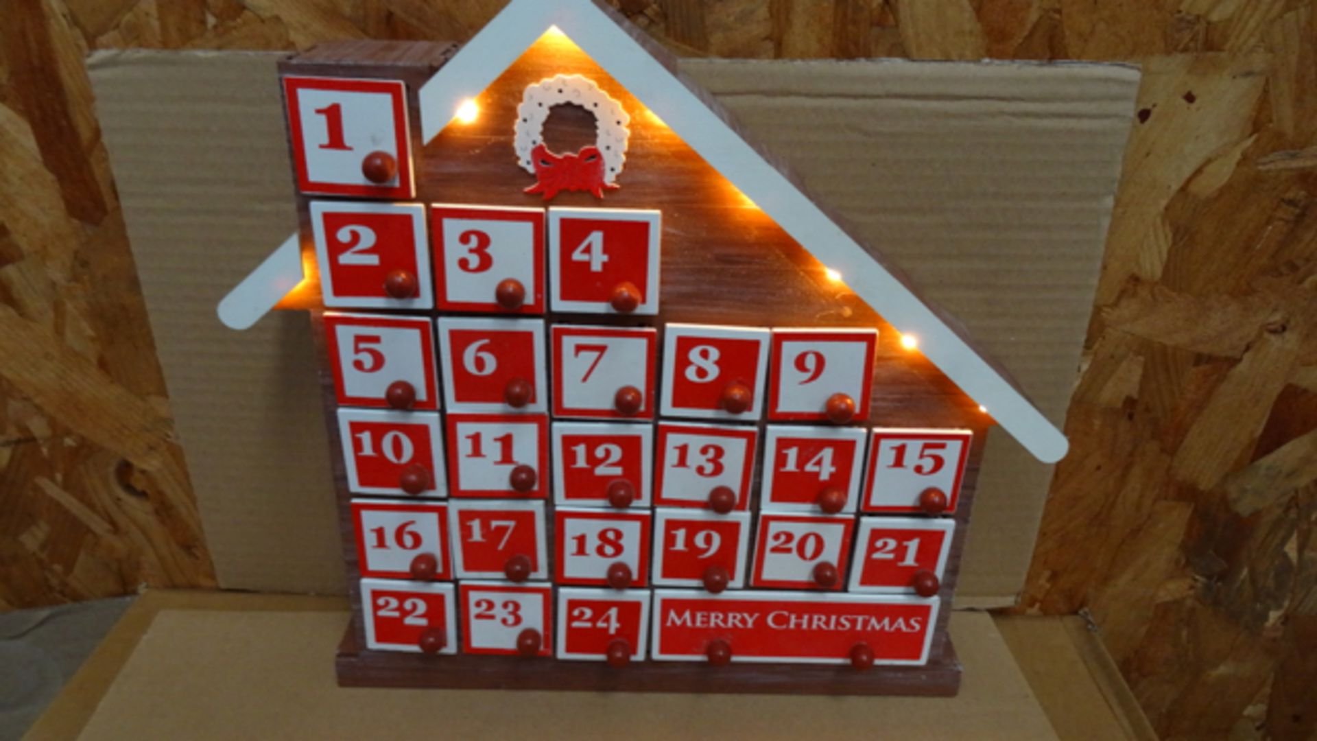 1 x Christmas Workshop Wooden Advent Calendar House with 8 LED Lights. RRP £40!
The Christmas