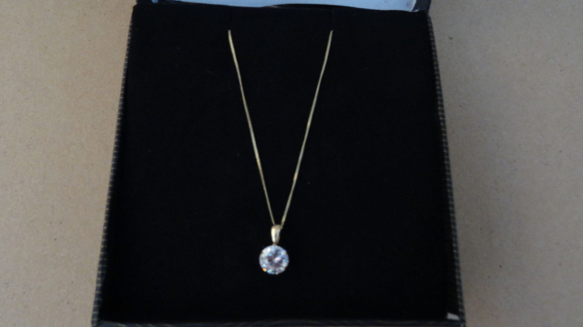 1 x 9 Carat Yellow Gold Chain with Cubic Zirconia Pendant. Retail value £79. UK TRACKED DELIVERY
