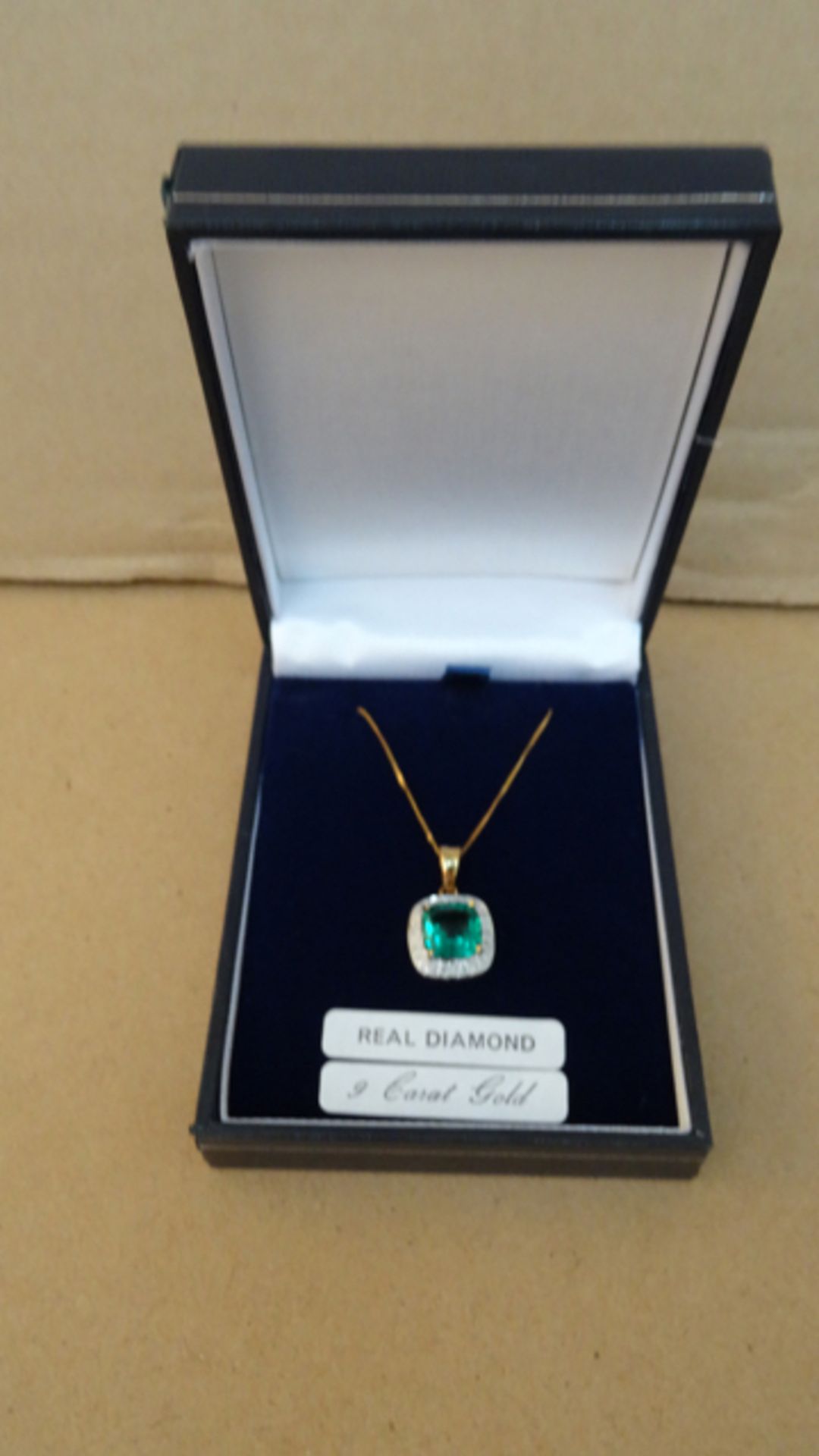 9ct Yellow Gold Chain with Emerald & Diamond Pendant. Beautiful piece, treat your loved one.