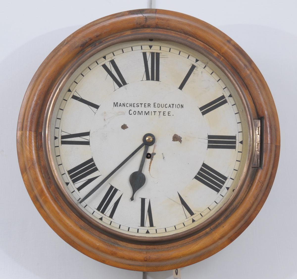 A Victorian Manchester Education Committee fusee wall timepiece with a 35cm white dial with Roman