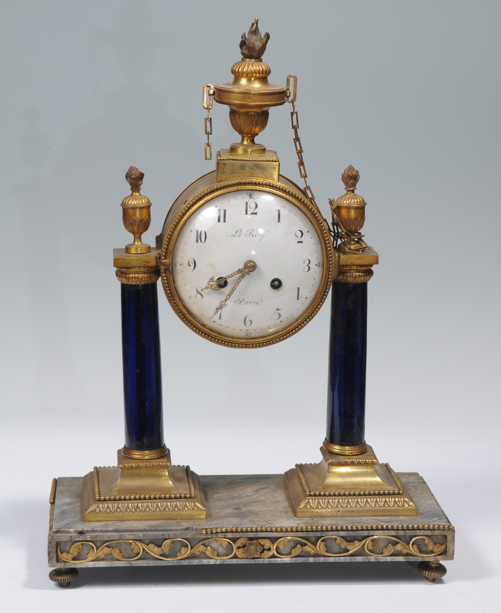 A 19th century French mantle clock with a 15cm convex dial signed Le Roy, with Arabic numerals the