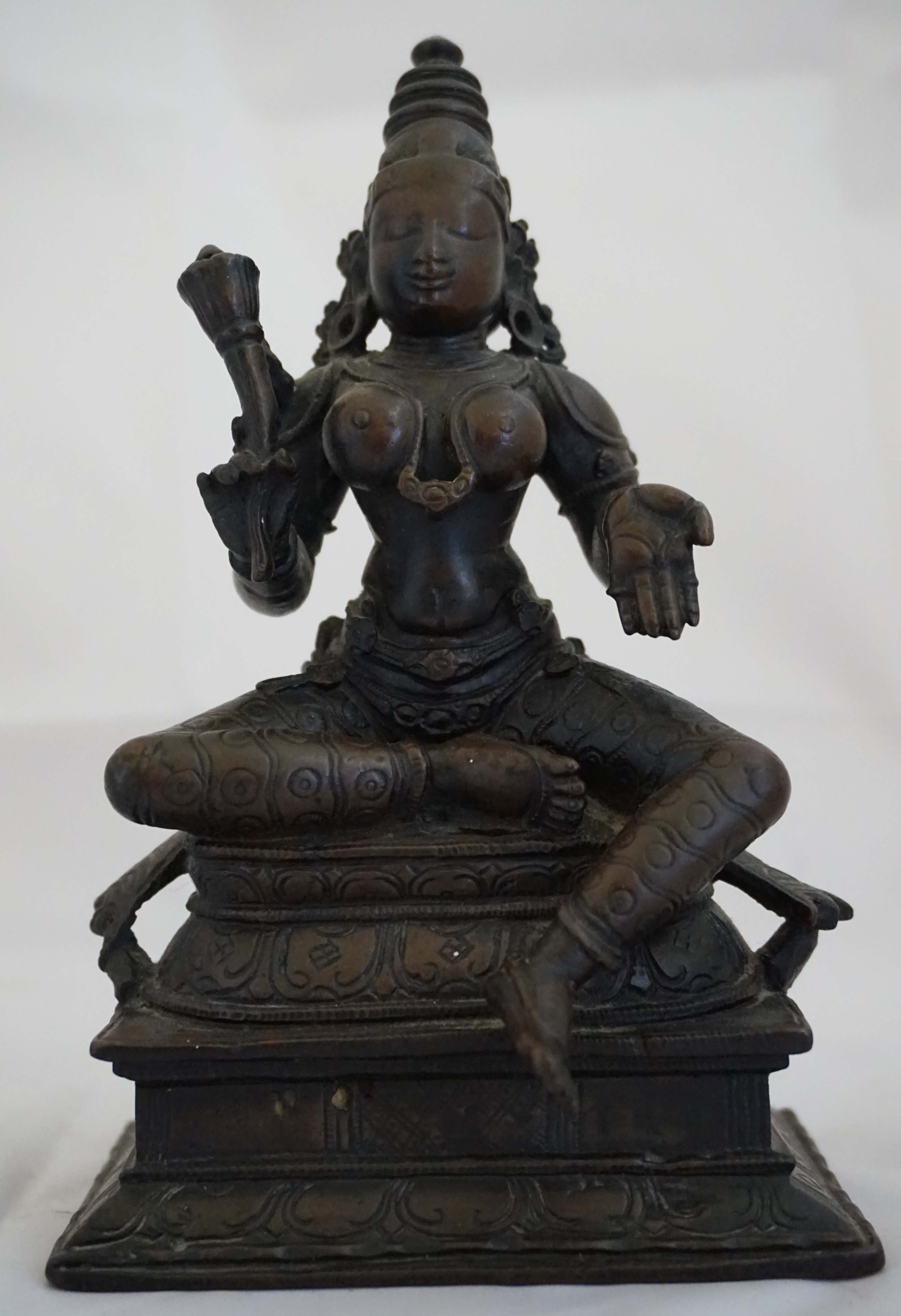 A Sino-Tibetan bronze figure of a Bodhisattva, 19th/20th century, seated in meditation on a double