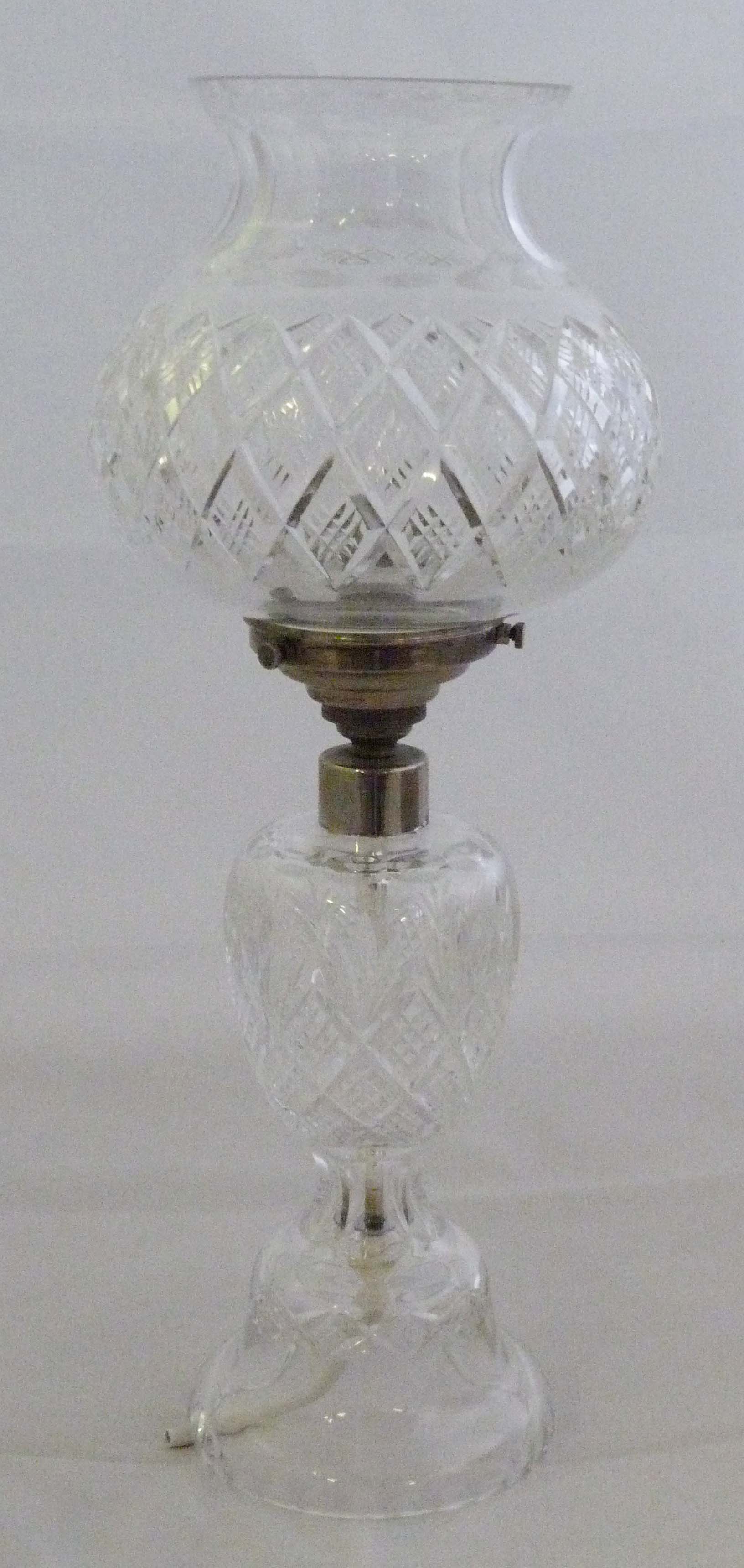 A reproduction cut glass table lamp with baluster form shade, with chrome divide, height is 42.5cm