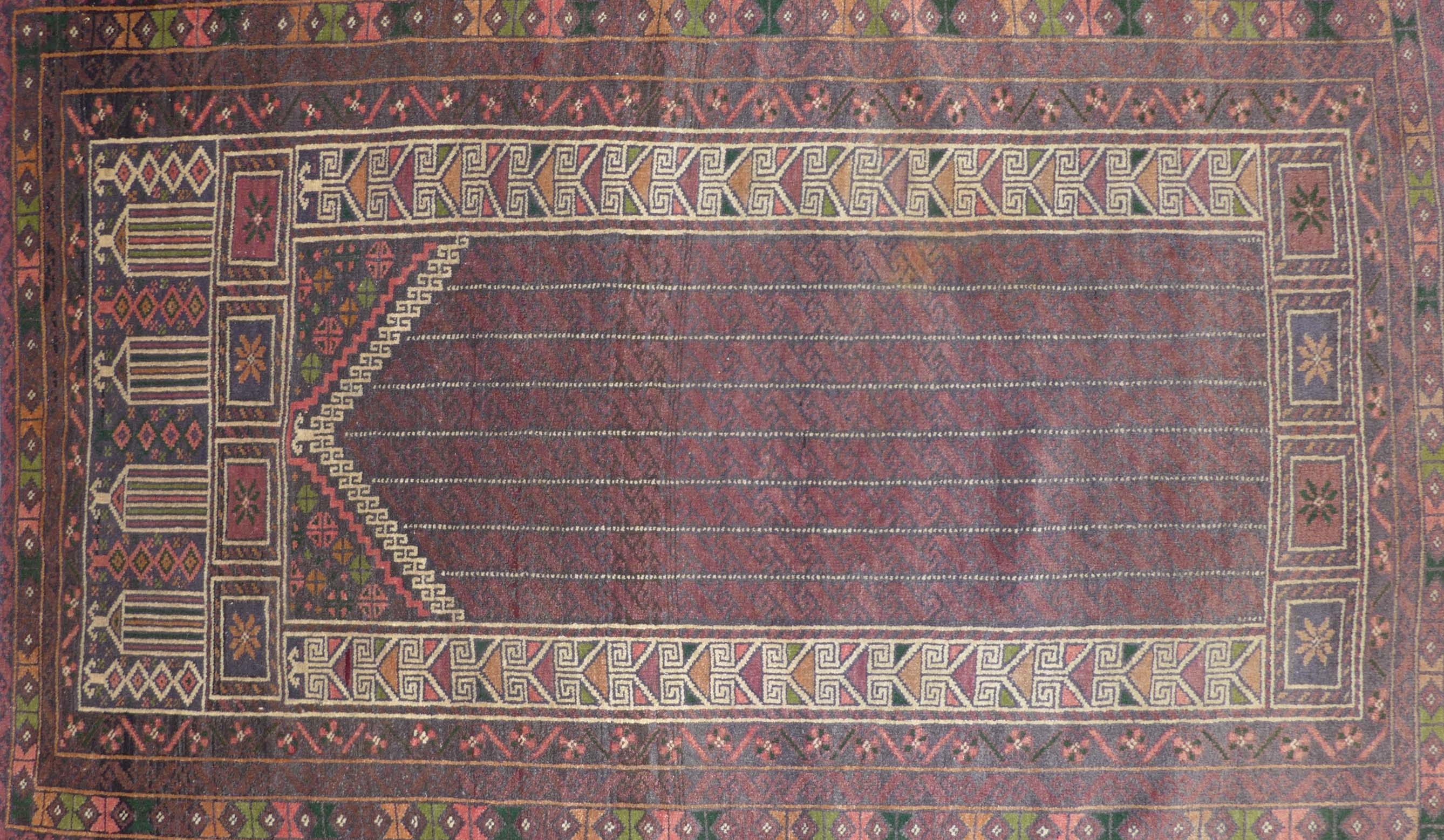 A fine quality handmade Persian prayer rug, mainly rose ground, the central panel with arrow