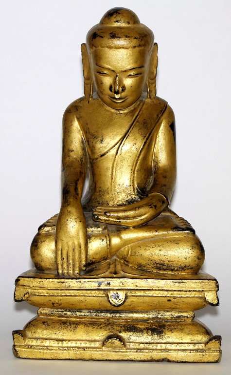 A Burmese 'Shan' style giltwood Buddha, 19th century, carved seated in Vajrasana, with hands cast in