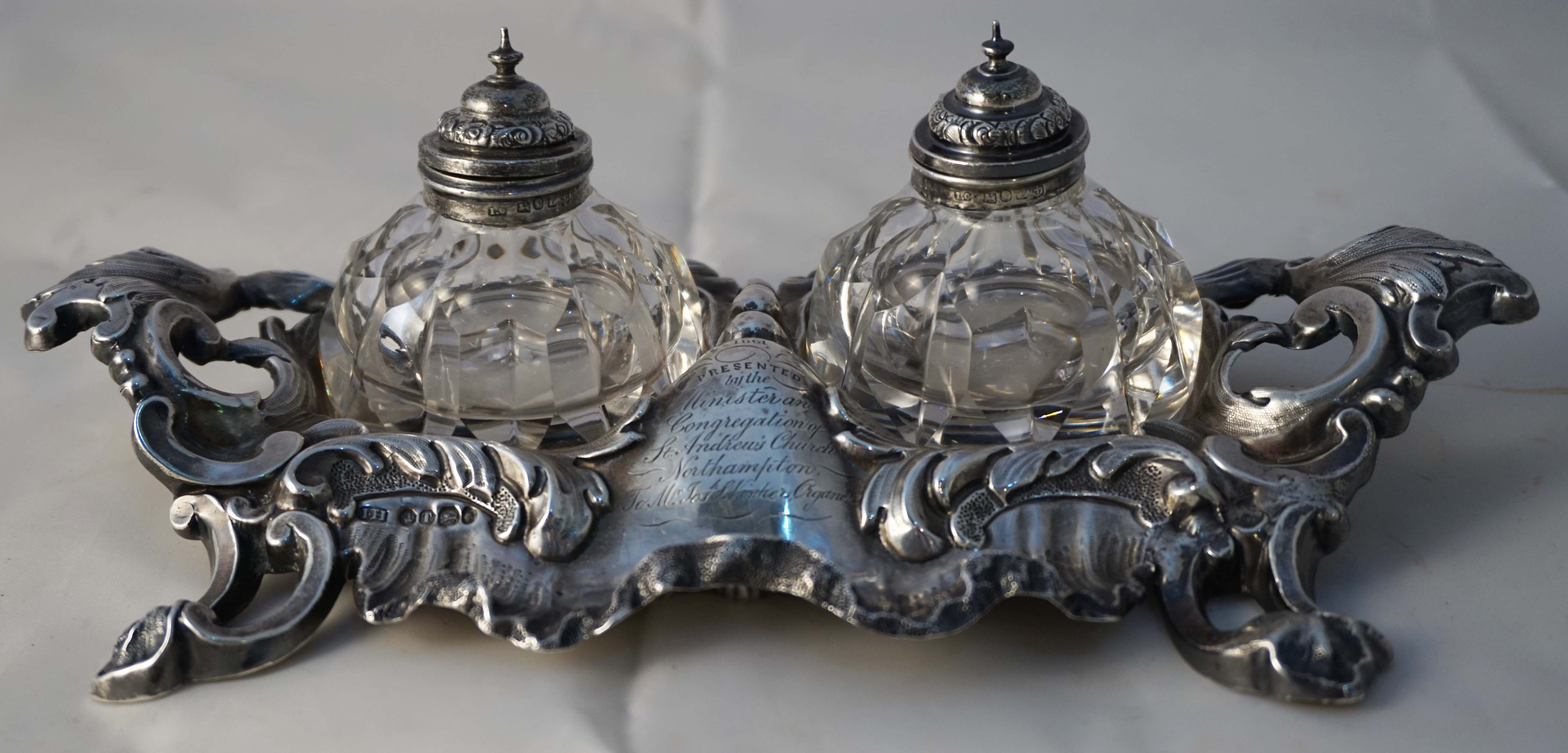 A Victorian hallmarked silver desk stand, with two detachable cut glass inkwells with silver collars