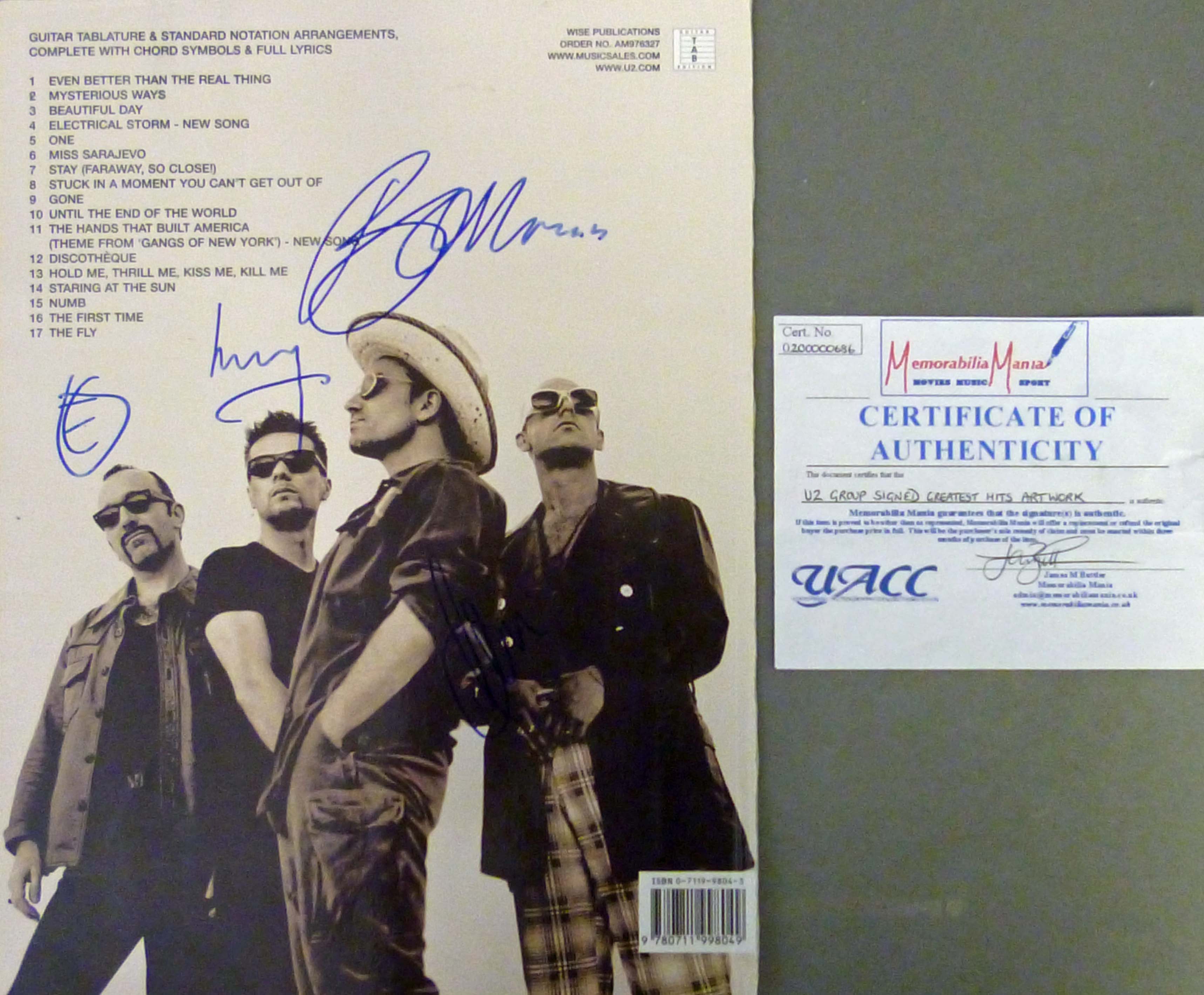 U2 Autograph (Bono, The Edge, Adam Clayton & Larry Mullen JR). Autographs are on the rear cover of