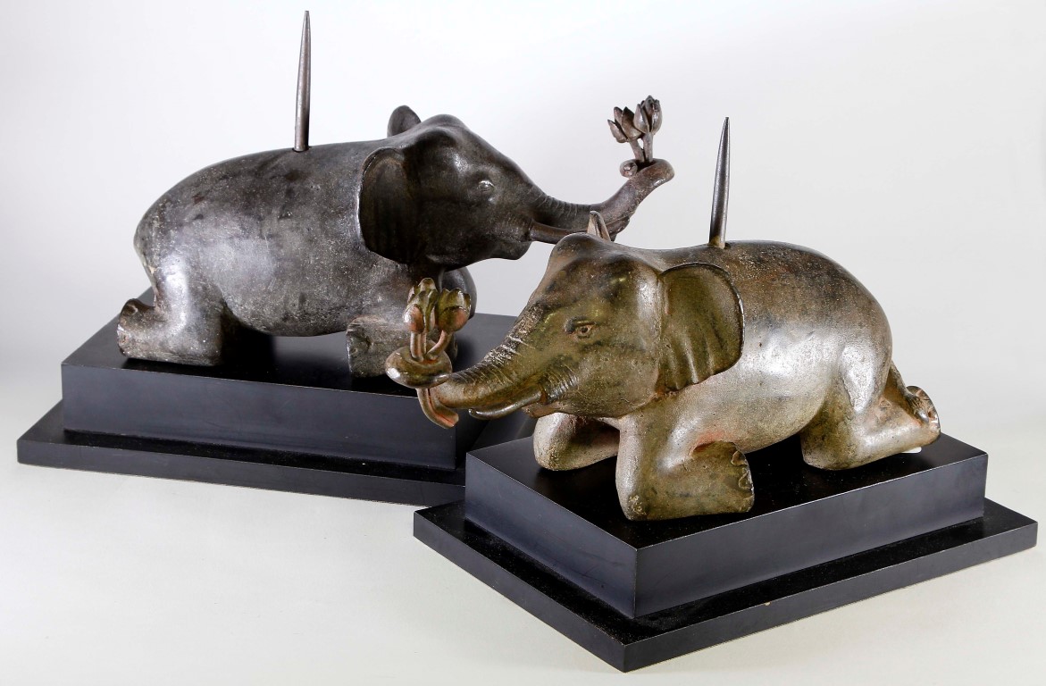 A pair of fine quality Thai bronze elephant pricket candlesticks, 19th/20th century, each modelled