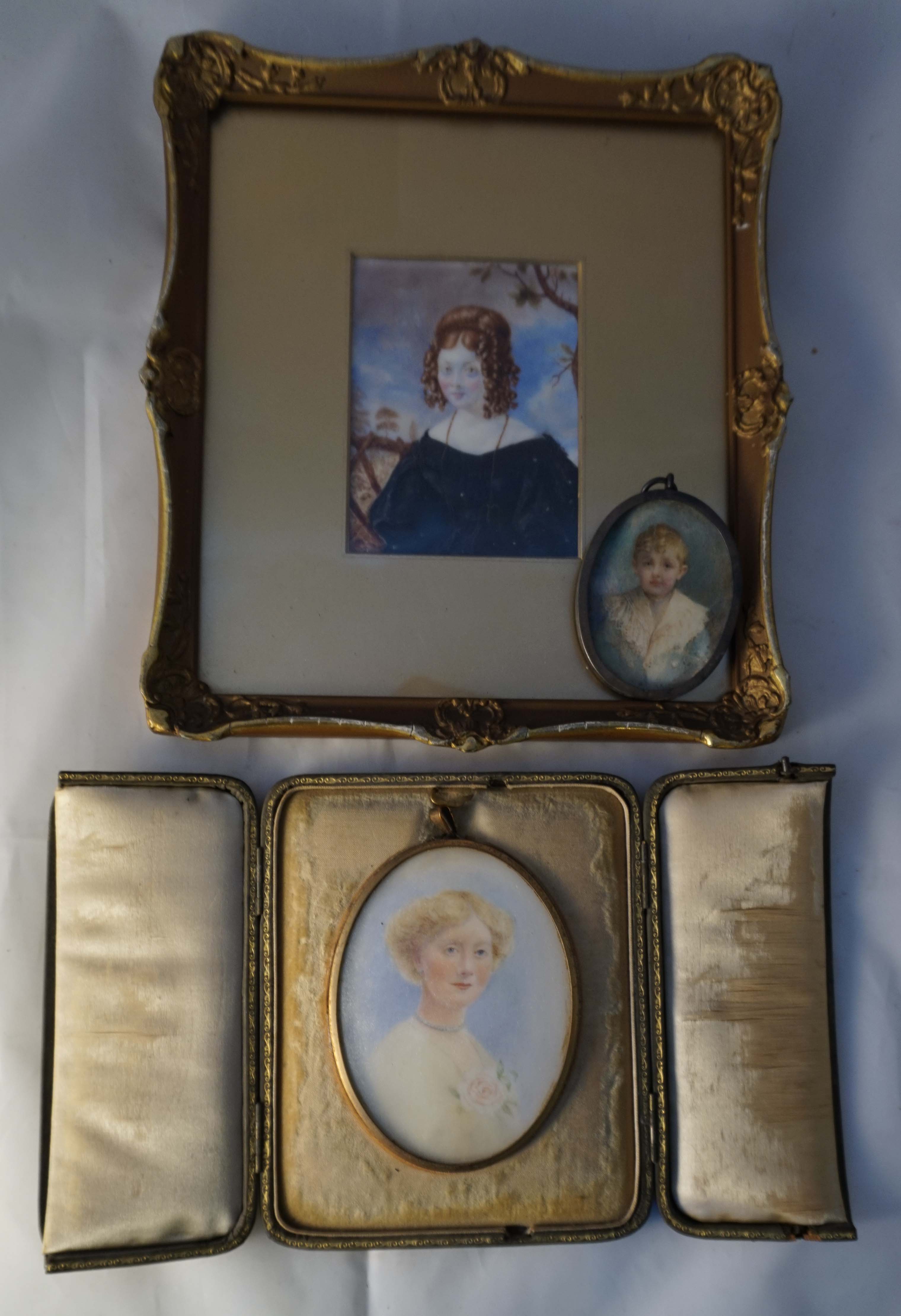 A 19th century portrait miniature of Mrs Wallace, inset in ornate gilt frame, length excluding frame