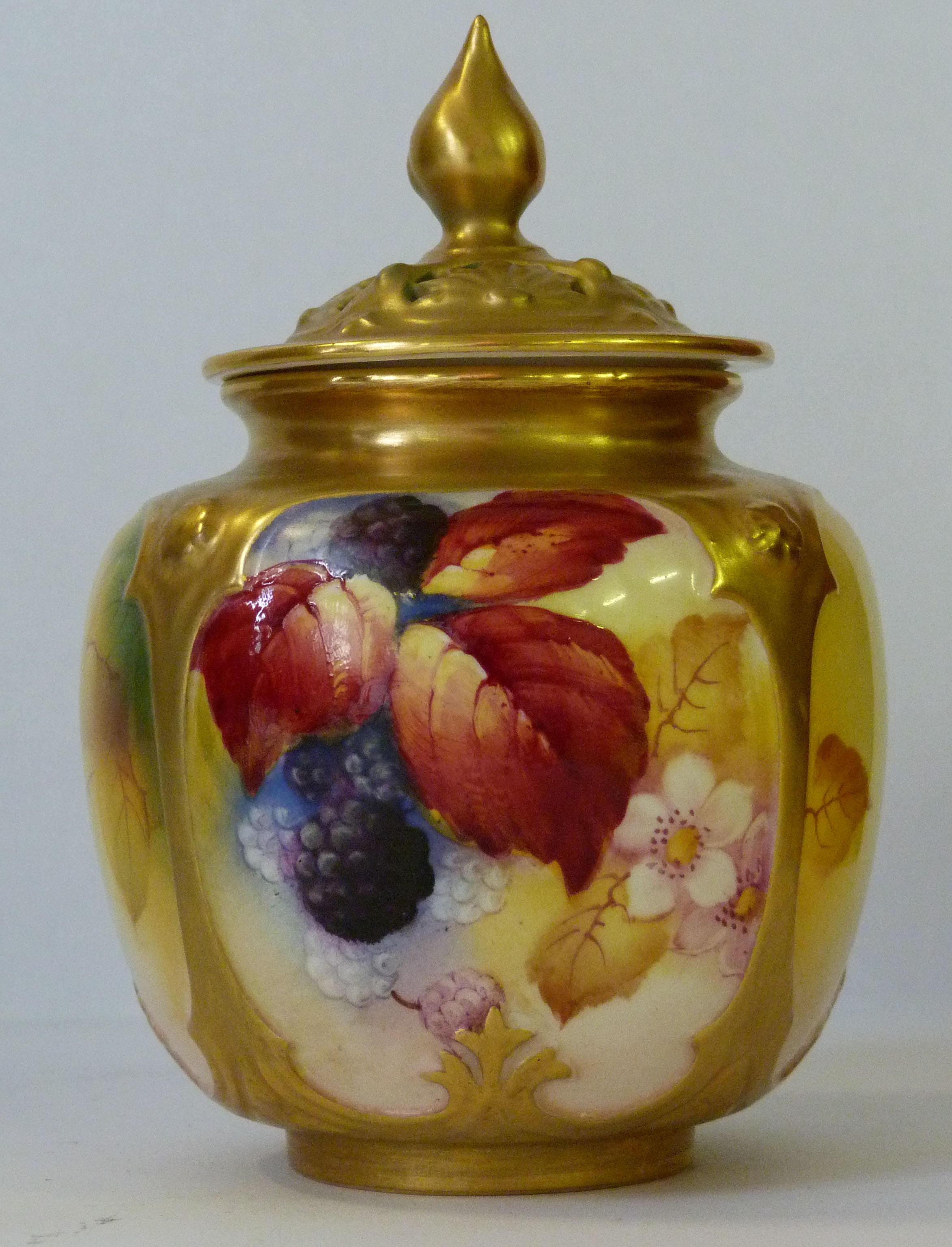A Royal Worcester hand painted pot pourri and cover, decorated with berries and foliate, signed by