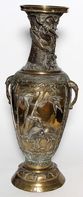 A Japanese polished bronze vase, late Meiji period (1868-1912), of baluster form, flanked by twin