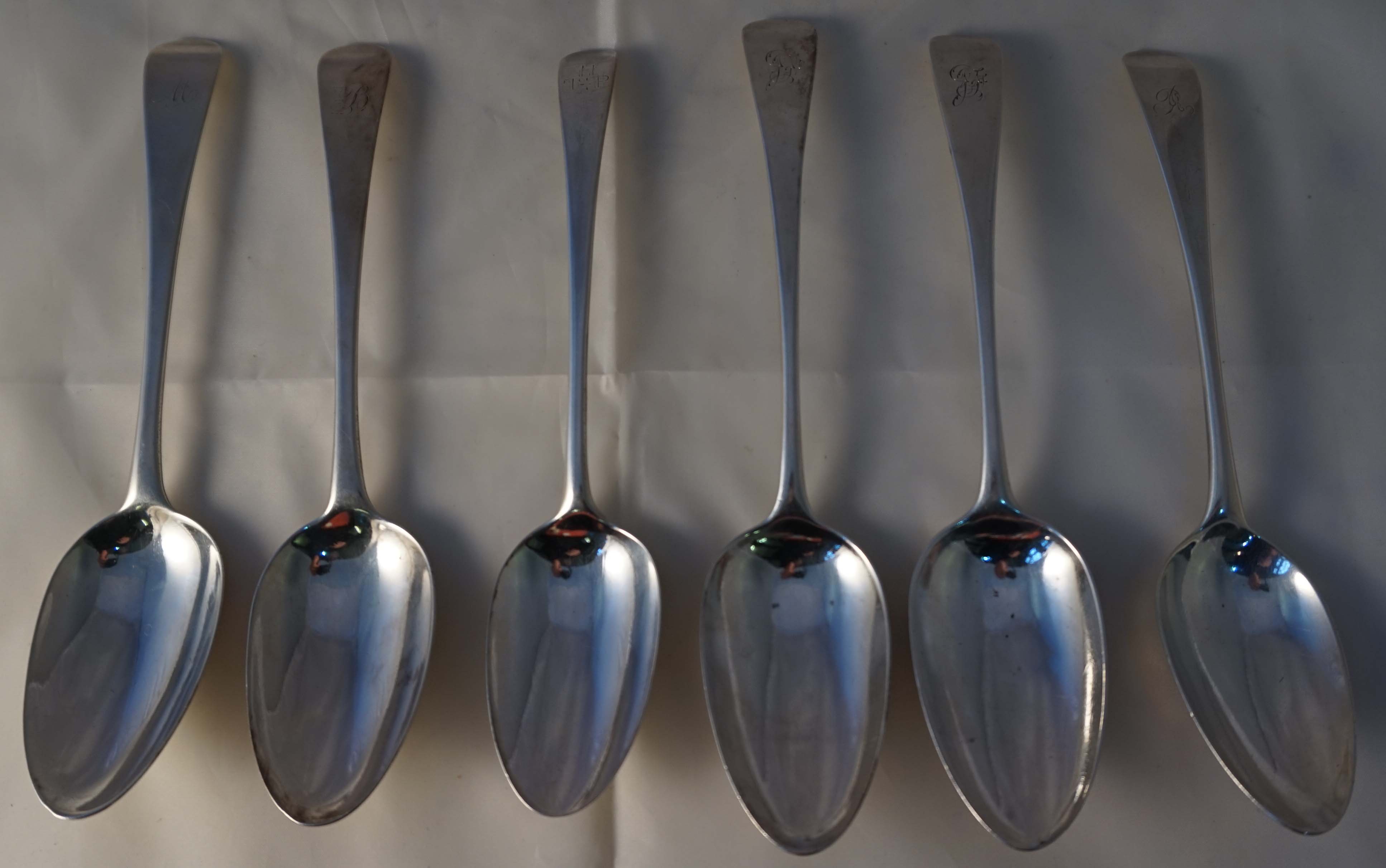 Six various George III and later hallmarked silver tablespoons, each having engraved initials to