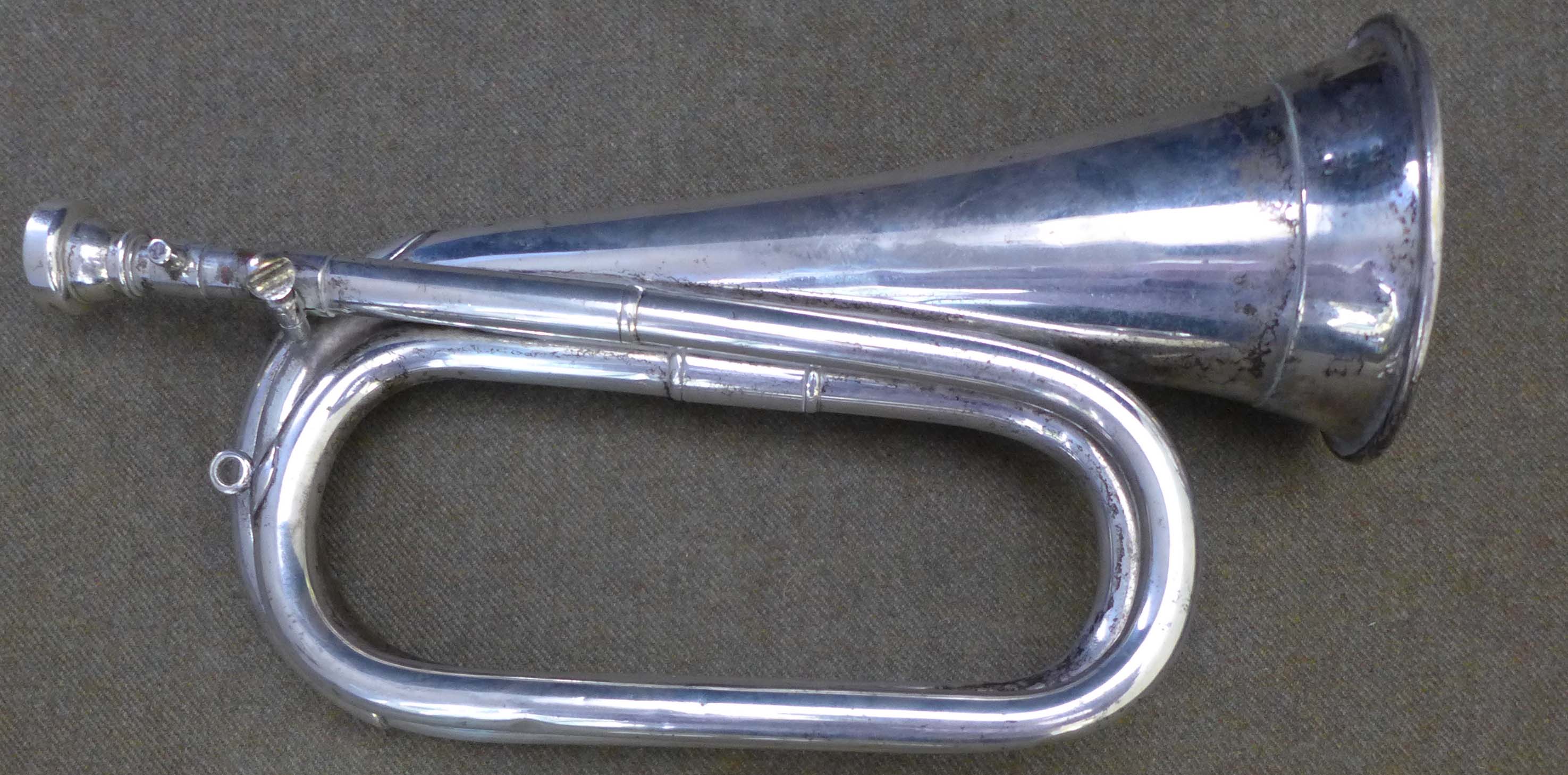 A plated tunable bugle by Barratts, according to the vendor he used this whilst in the Royal Marines
