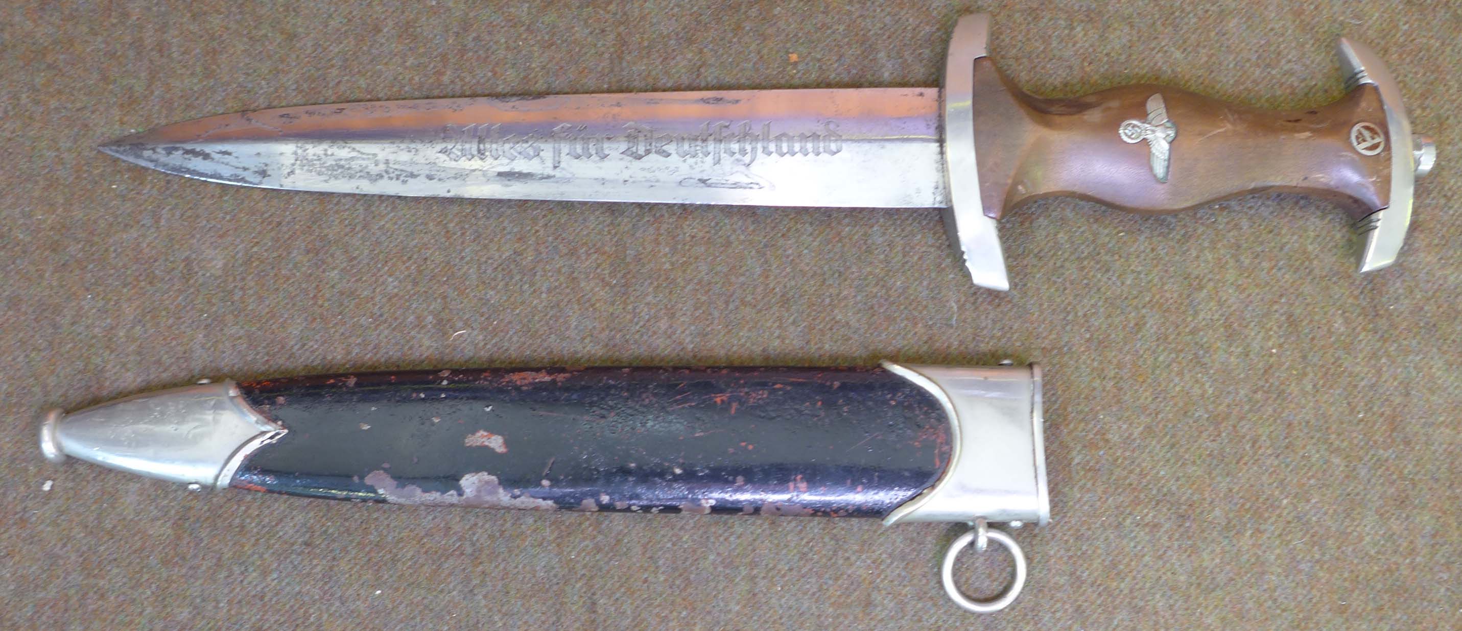A Nazi Germany SA dagger, the 22cm straight double edged blade, inscription Alles fur Deutschland,