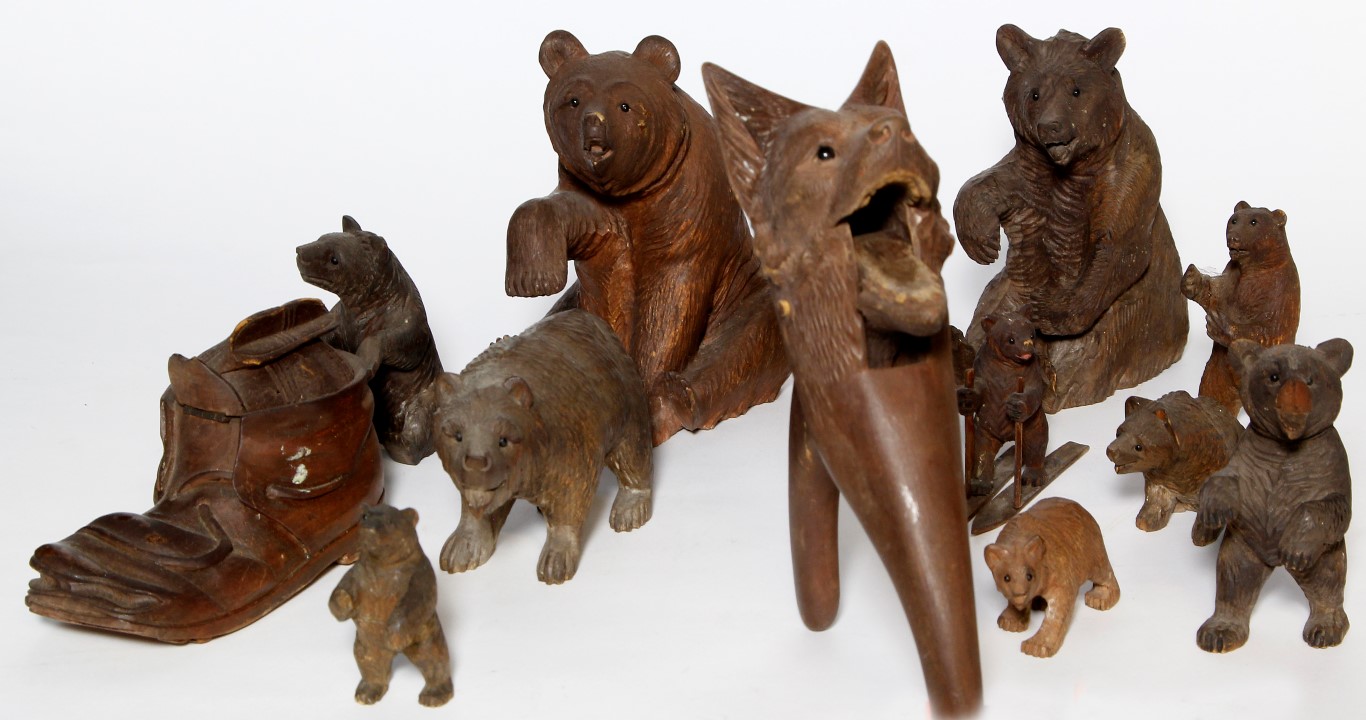 A collection of ten 19th century Black Forest bears, to include an example modelled as a skier, also