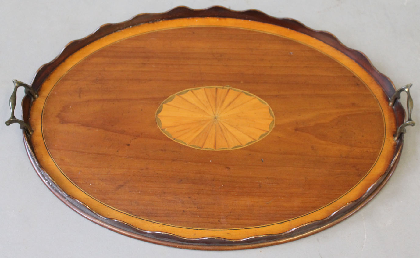 An Edwardian Sheraton revival inlaid mahogany twin handled butlers tray, with inlaid shell to the