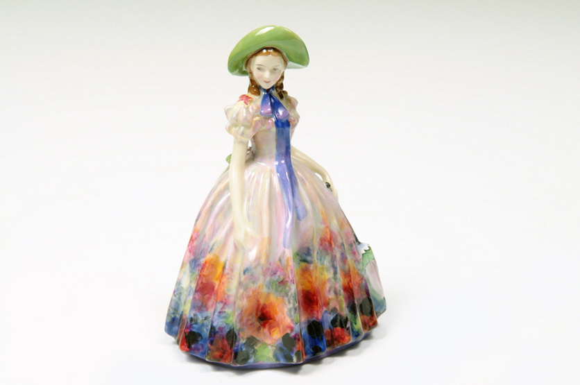 A ROYAL DOULTON FIGURE EASTER DAY, HN2039 designed by L Harradine 18.4cms issued 1949 to 1969.