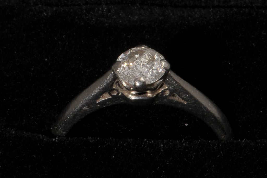 A PLATINUM AND DIAMOND SINGLE STONE RING, London 2002. Brilliant claw set stone estimated to weigh