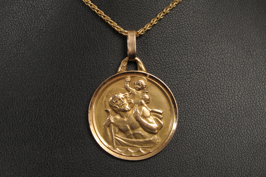 A MODERN St CHRISTOPHER PENDANT, with foreign assay marks and on a fancy 18ct gold neck chain.