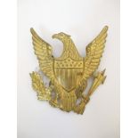 US MILITARY HELMET PLATE - EAGLE FACING LEFT Gilt metal helmet plate.