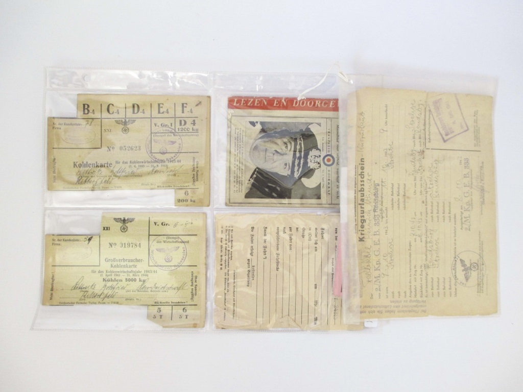 6 THIRD REICH NAZI DOCUMENTS Comprising a booklet “De Wervelwind”; a railway pass and 4 others.