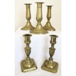 EARLY 19th CENTURY GEORGIAN BRASS CANDLESTICKS Two pairs and a single brass candlesticks. Each