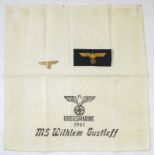 WW2 GERMAN KRIEGSMARINE ITEMS Including a stamped cloth cover, bevo breast badge. Gilt metal cap