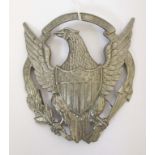 US MILITARY HELMET PLATE - EAGLE FACING LEFT White metal helmet plate.