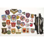 SELECTION OF WORLD CLOTH PATCHES World badges (33) Plus 3 navy cap tallies.