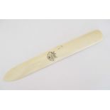 CARVED ELEPHANT IVORY PAGE TURNER Plain ivory page turner with a "scrimshaw" type monogram. Approx