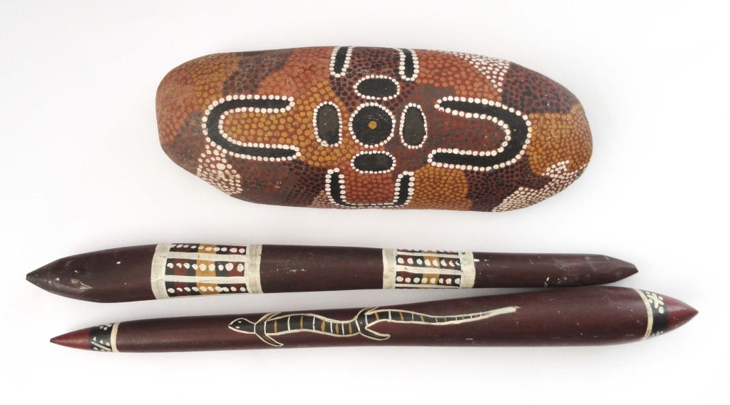 AUSTRALIAN ABORIGINAL ITEMS  Two painted hard wood clubs and a painted driftwood