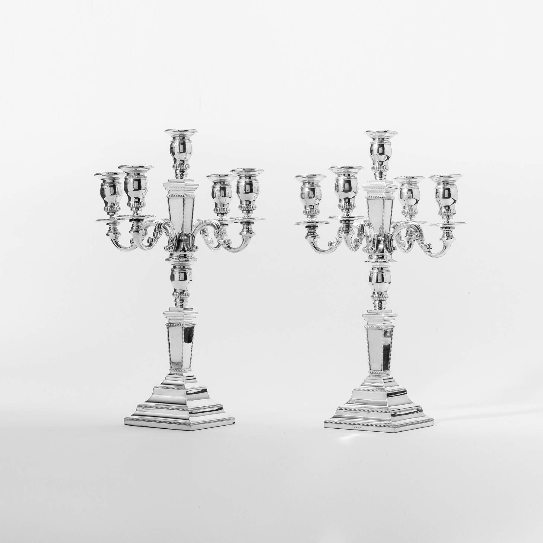 A pair of silver two-part, five-light candelabra