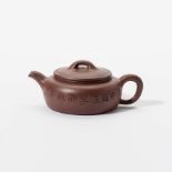 A compressed globular Yixing teapot with lid by Yang Pengnian