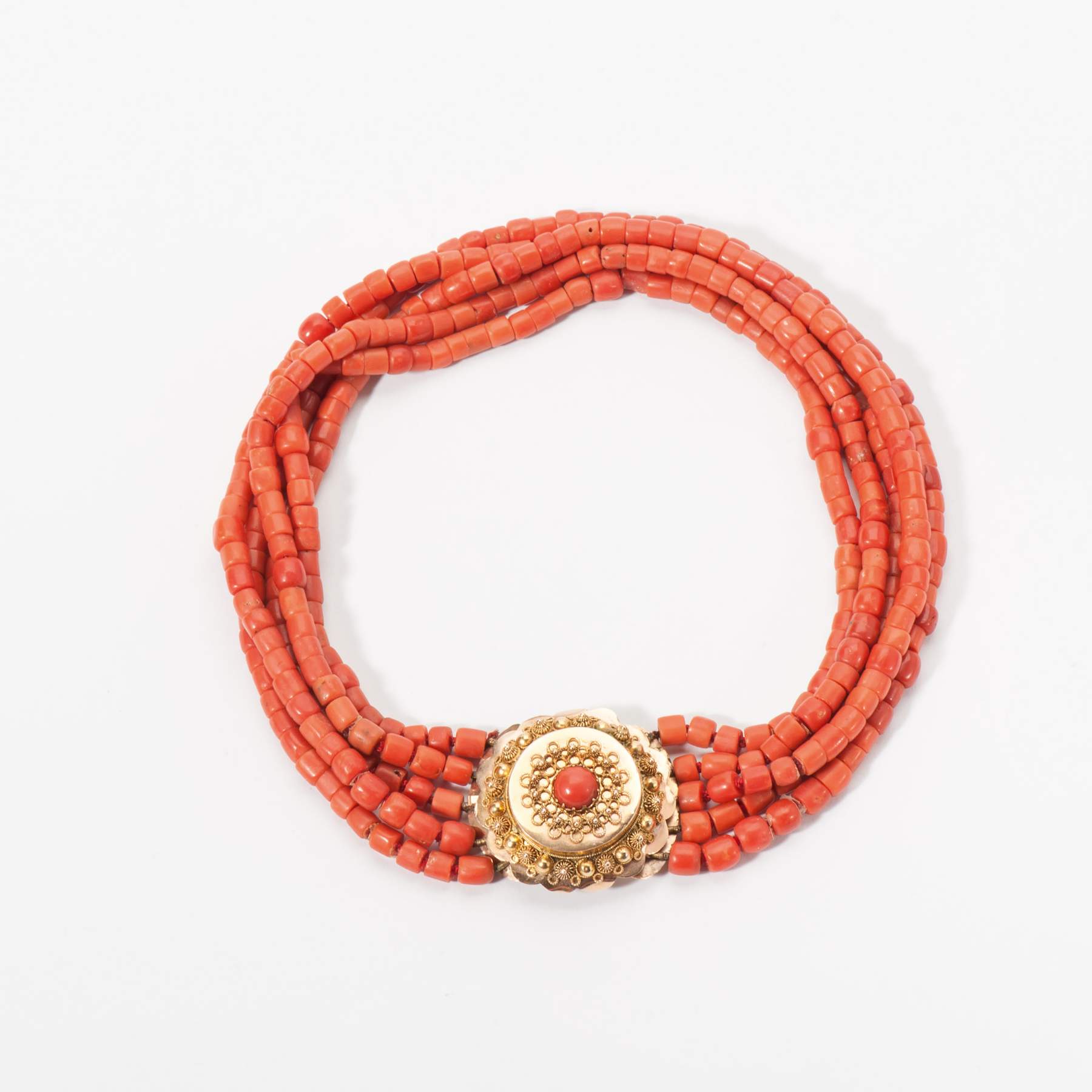 An antique five rowed red coral choker on a 14 carat gold lock